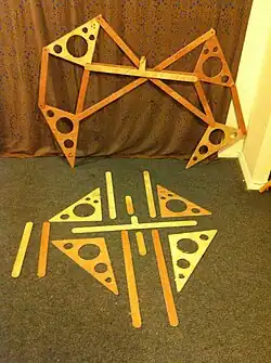 Photo 1:One assembled leg linkage and the parts to the next one